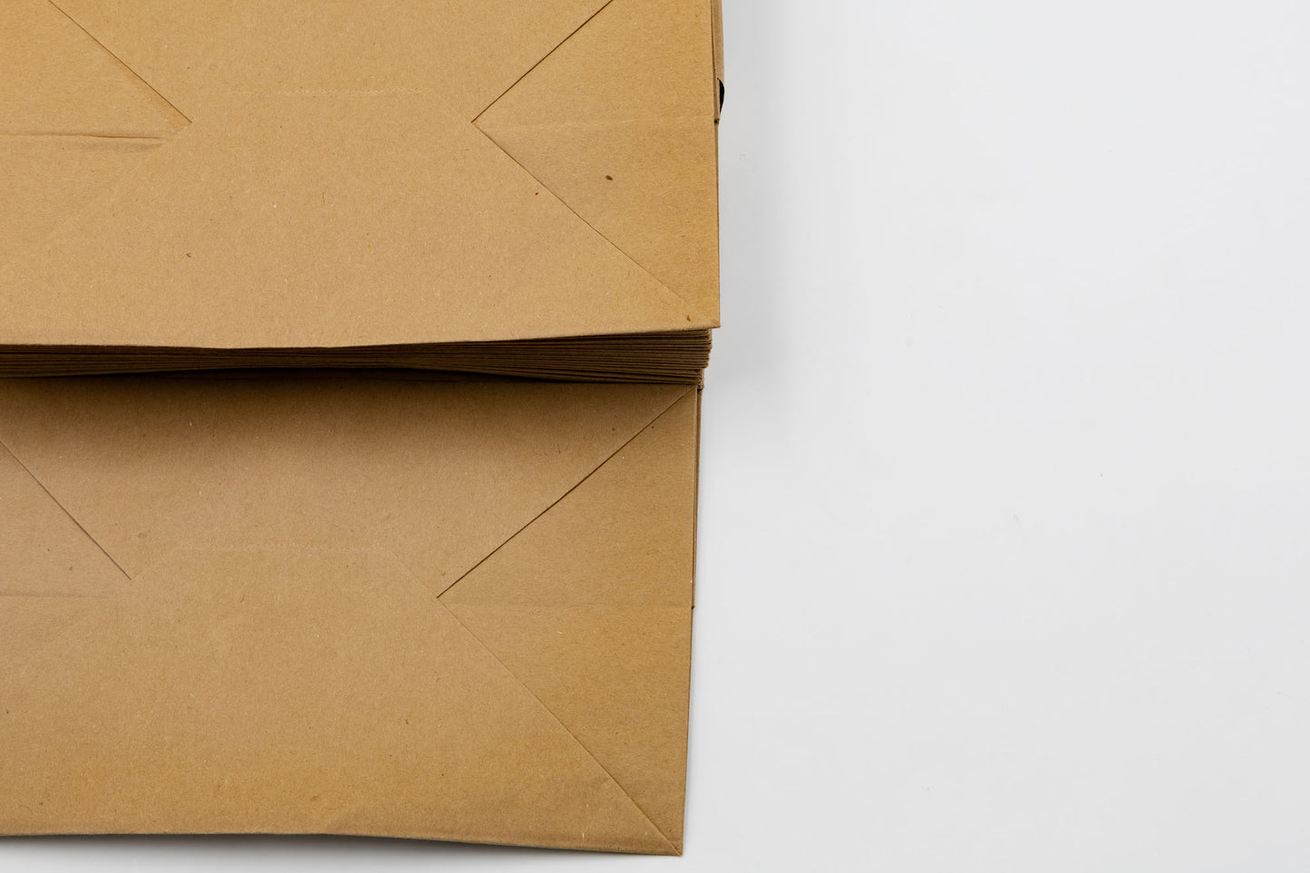 Pack de 25 Bolsas de Papel Kraft 110gr/m2 con Asas Planas
