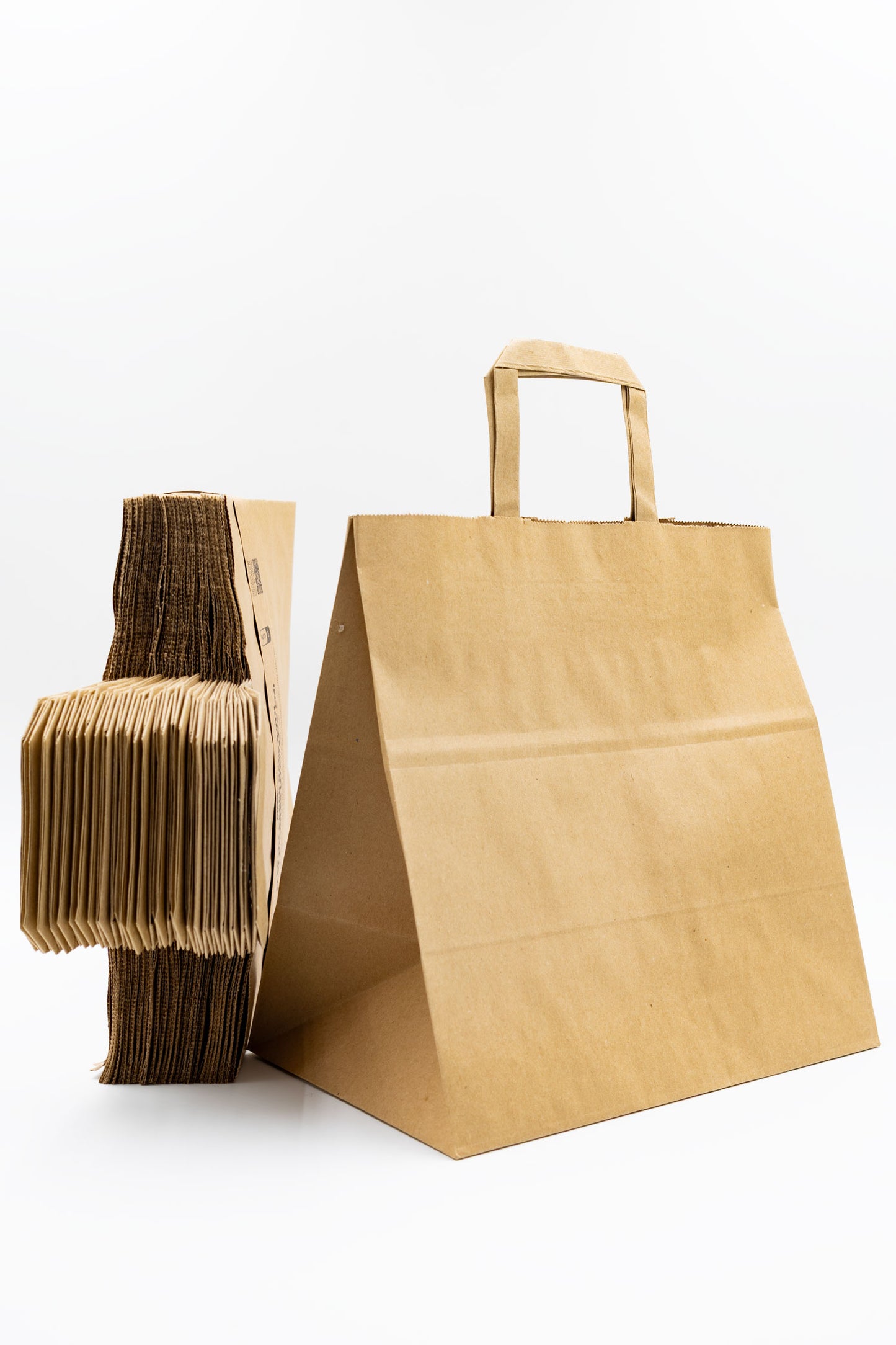 Pack de 25 Bolsas de Papel Kraft 110gr/m2 con Asas Planas